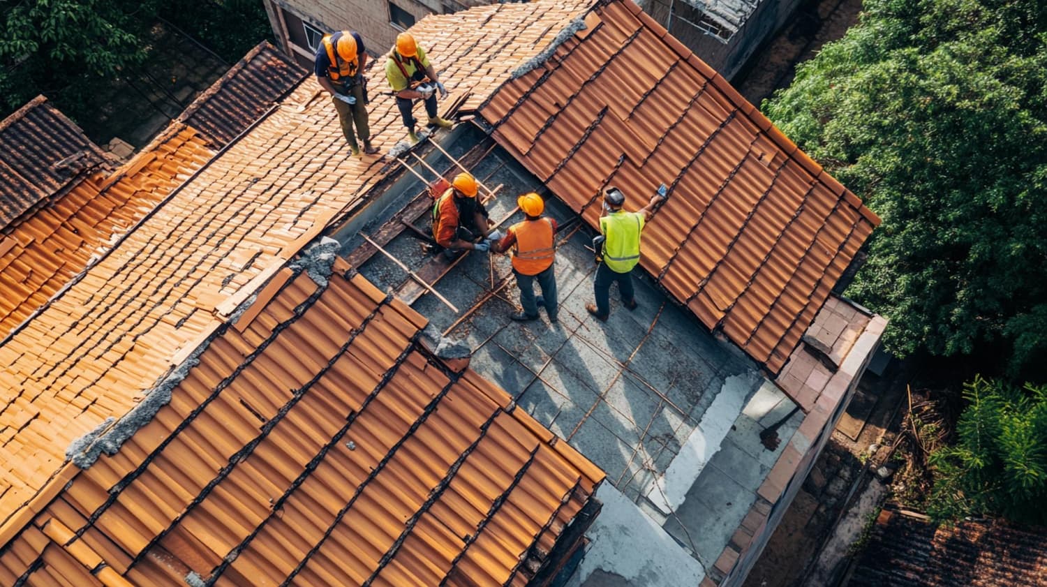 Aerial view of Summit Shield crew working on a large tile roof